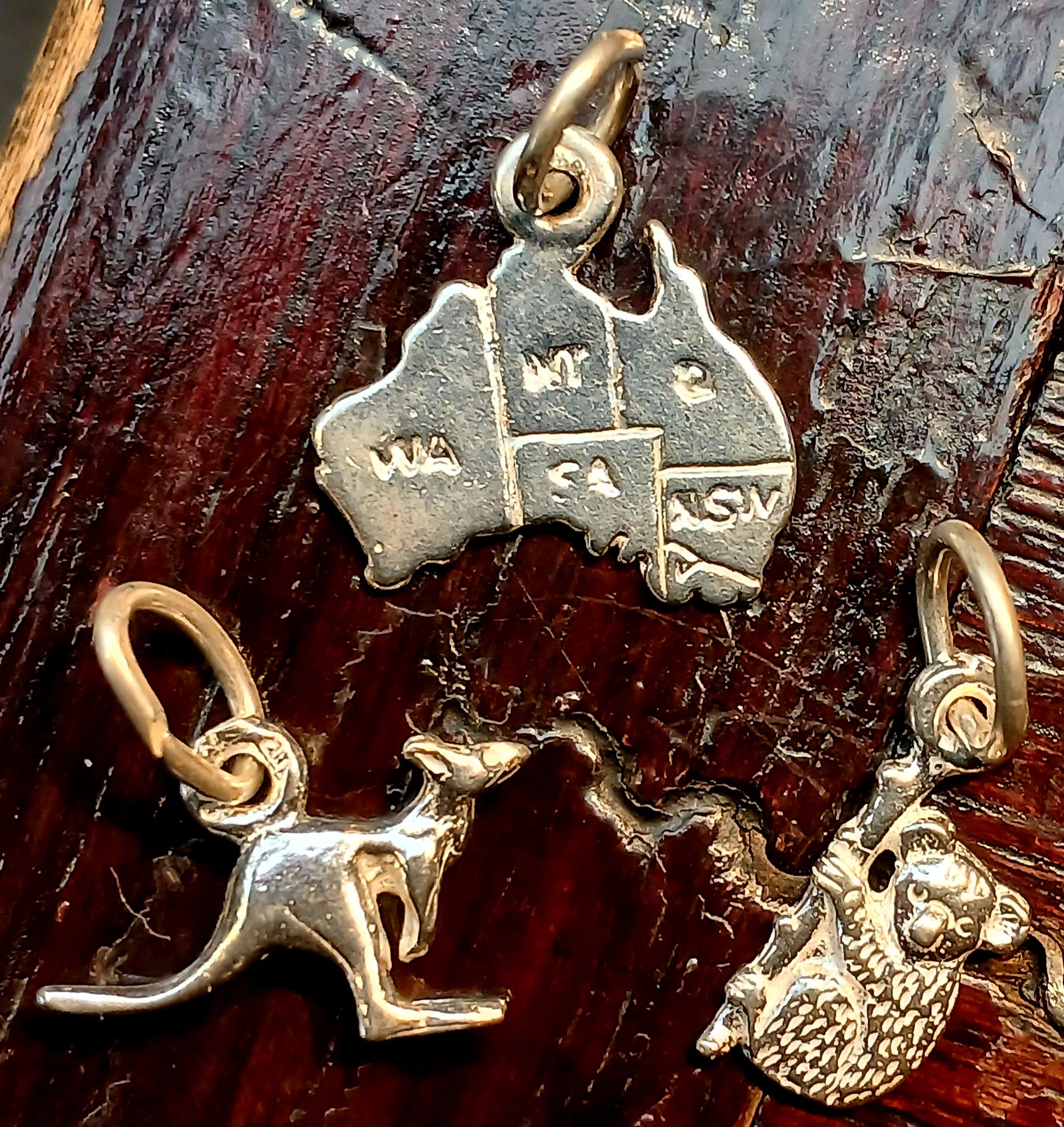 Three Australian charms that represent Australia, the jumping kangaroo, the map of Australia and the cute and cuddly koala. All solid sterling silver and made in Australia. 