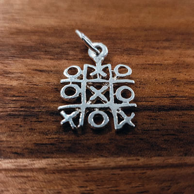 Silver Naughts and Crosses charm