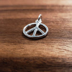 Silver rounded peace sign charm