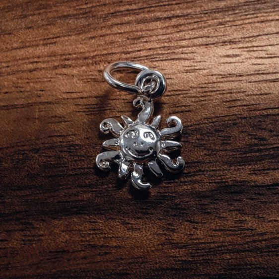Silver Sun charm