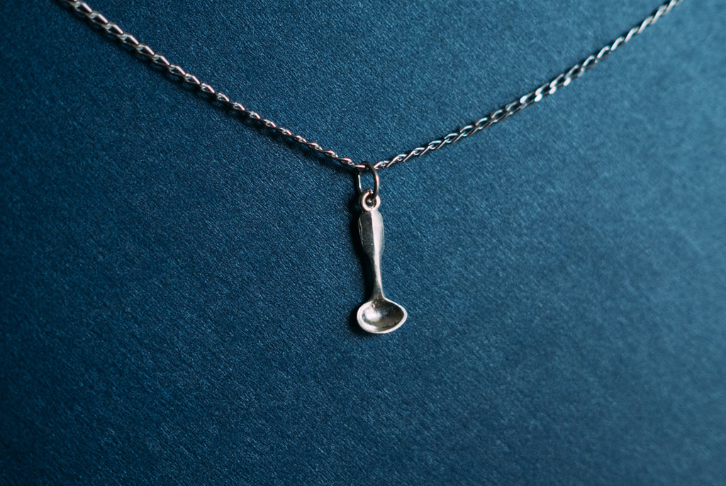 Ladle charm on a sterling silver necklace